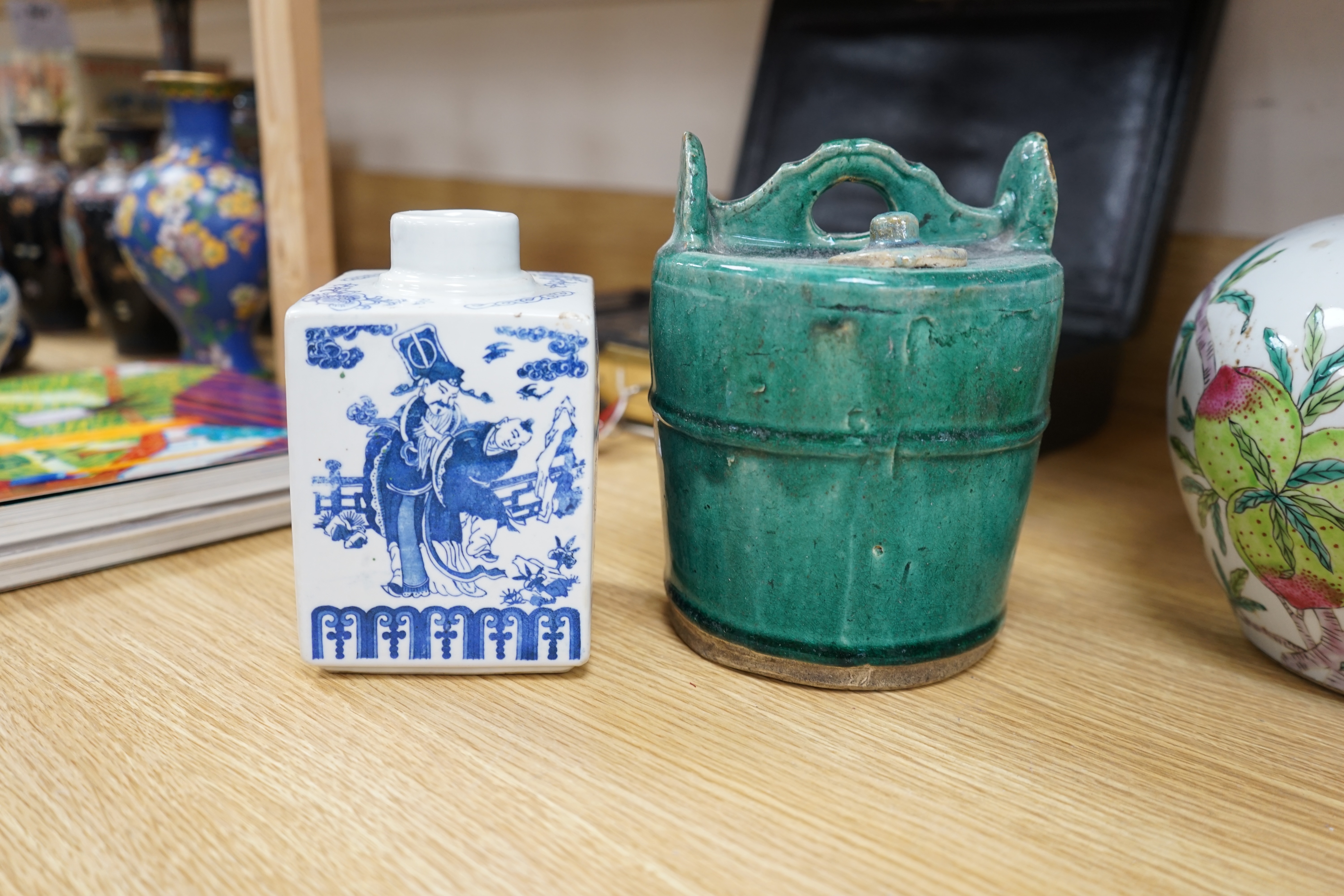 A collection of Chinese ceramics to include and bowls, plates, pottery dragon teapot and a green glaze water carrier, largest 31cm high. Condition - mostly fair